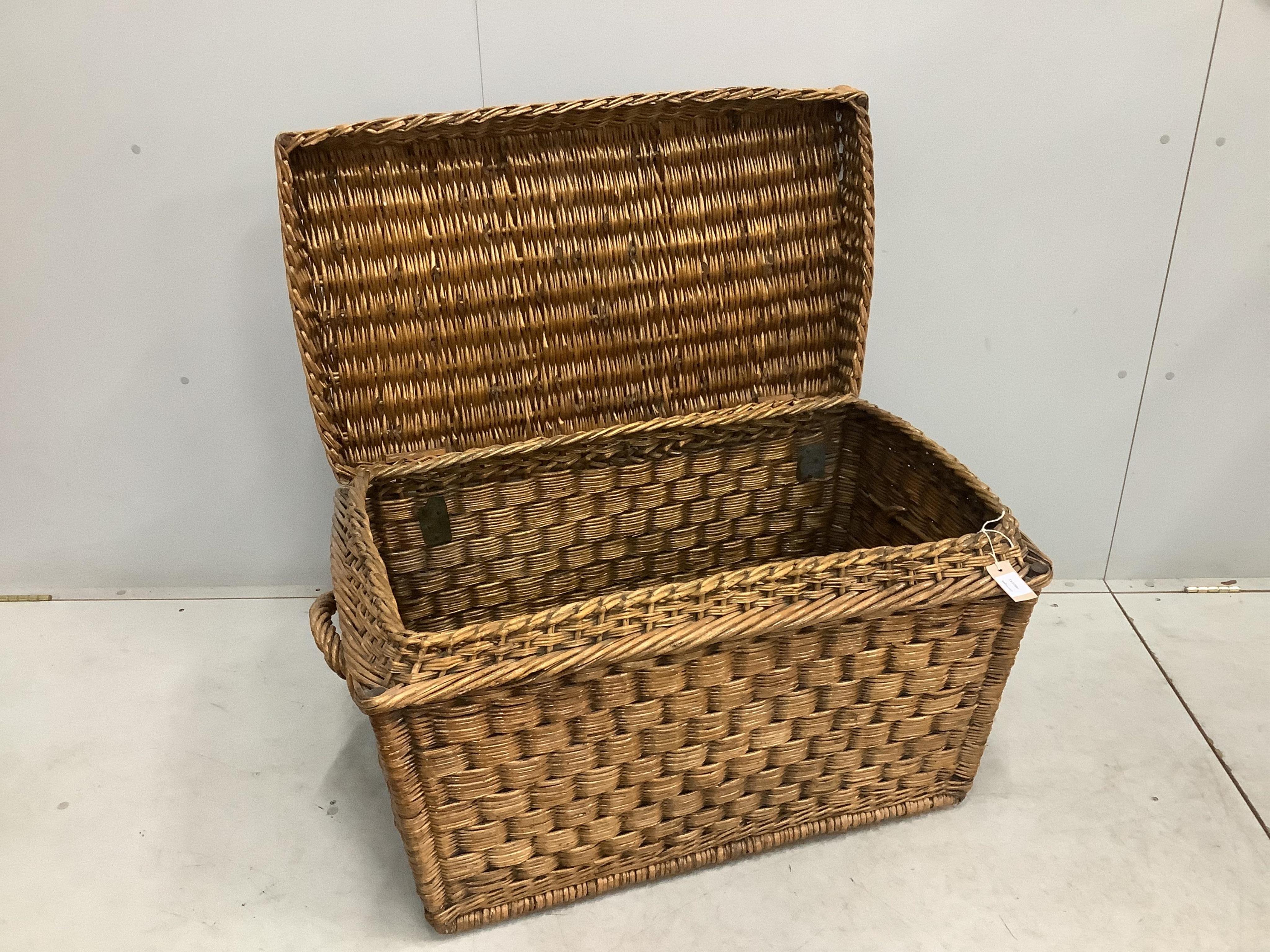 A vintage wicker laundry basket, width 93cm, depth 58cm, height 58cm. Condition - fair